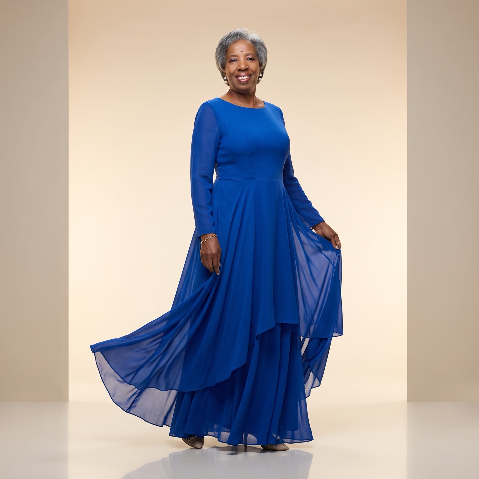 Audrey Scott seated in a royal blue suit in an editorial studio portrait